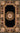 Black Wool area rug 4' X 4' - styled in a living room