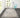Black Wool area rug 2'3" X 7 - styled in a dining room