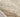 Tan Wool area rug 9' X 12' - styled in a bedroom