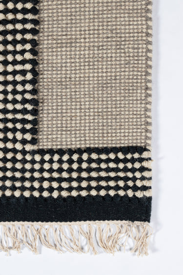 Black Contemporary area rug 2'3" X 8 - close-up of pattern and texture