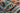 Blue Polypropylene area rug 5' X 7' - styled in a bedroom