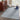 Grey area rug 2' X 3' - styled in a dining room