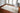 Beige area rug 2' X 3' - styled in a dining room