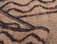 Contemporary rustic rug with jute and wool handwoven ripple design.