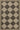 Black Polypropylene area rug 5'3" X 7 - styled in a living room