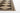 Black Polypropylene area rug 2'7" X 7 - styled in a living room