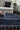 Navy Wool area rug 9' X 12' - styled in a bedroom