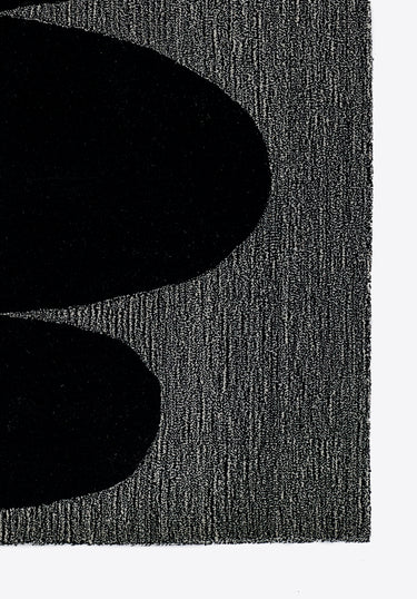 Black Geometric area rug 5' X 8' - close-up of pattern and texture