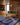 Blue area rug 12 8' X 10 - styled in a living room