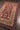 Red area rug 9'6" X 13 - close-up of pattern and texture