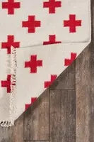 Handmade wool geometric rug enhancing cozy reading nook