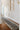 Beige area rug 2' X 3' - styled in a bedroom