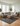 Oriental Weavers Atlas 8048Q black and gray geometric rug styled in a modern living room