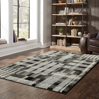 Oriental Weavers Atlas 752C0 Black and Gray Medium Living Room Rug Polypropylene Blend Area Rug 5'3" x 7'3" — styled in a furnished room