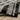 Oriental Weavers Atlas 752C0 Black and Gray Medium Living Room Rug Polypropylene Blend Area Rug 5'3" x 7'3" — draped to show softness and drape