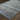 Oriental Weavers Atlas 8033J Blue and Gray Oversized Dining Room Rug Polypropylene Blend Area Rug 8'6" x 11'7" — angled view showing pattern scale