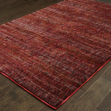 Oriental Weavers Atlas 8033K Red and Rust Extra Large Room Anchor Solid Area Rug 10' x 13'2" — angled view showing pattern scale