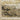 Oriental Weavers Bauer 2061X Gold and Black Medium Living Room Rug Abstract Area Rug 5'3" x 7'6" — folded corner showing the backing