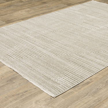 Oriental Weavers Bauer 4150E Beige and Ivory Compact Bedroom Accent Polyester Area Rug 3'10" x 5'5" — angled view showing pattern scale