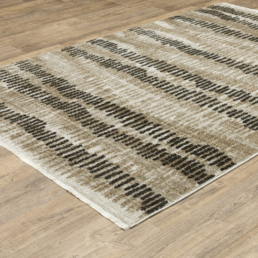 Oriental Weavers Bauer 8120D Beige and Charcoal Oversized Dining Room Rug Abstract Area Rug 7'10" x 10'10" — angled view showing pattern scale