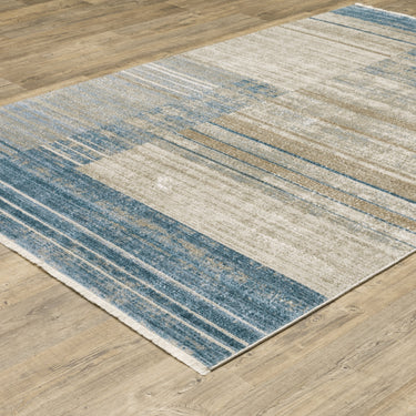 Oriental Weavers Bauer 090B2 Blue and Beige Oversized Dining Room Rug Geometric Area Rug 7'10" x 10'10" — angled view showing pattern scale