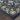 Oriental Weavers Bowen 534L2 Navy and Gold Compact Bedroom Accent Medallion Area Rug 3'10" x 5'5" — corner detail and edge binding