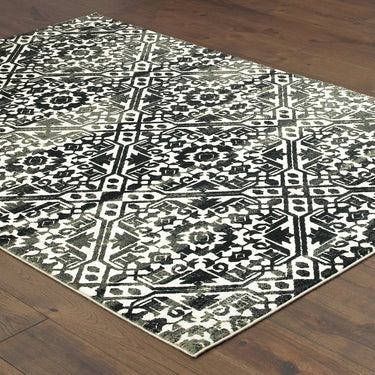 Oriental Weavers Bowen 5506E Navy and Ivory Compact Bedroom Accent Geometric Area Rug 3'10" x 5'5" — angled view showing pattern scale