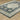 Oriental Weavers Branson BR05A Teal Blue and Ivory Extra Large Room Anchor Medallion Area Rug 9'10" x 12'10" — angled view showing pattern scale
