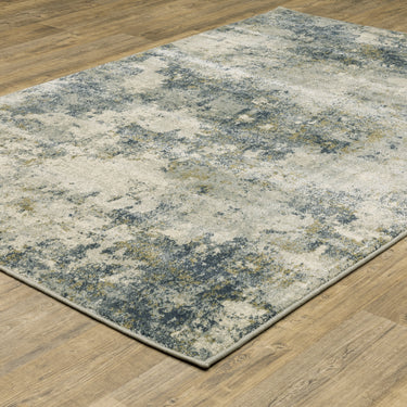 Oriental Weavers Branson BR12A Beige and Teal Large Seating Area Rug Polypropylene Area Rug 6'7" x 9'2" — angled view showing pattern scale