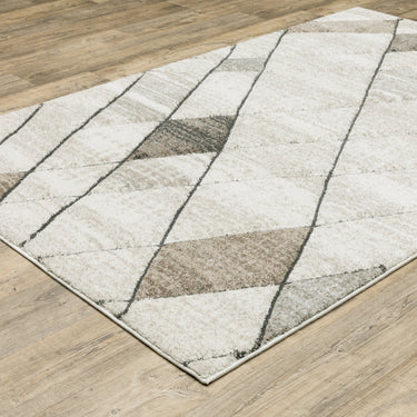 Oriental Weavers Cambria 4928A Beige and Gray Extra Large Room Anchor Geometric Area Rug 9'10" x 12'10" — angled view showing pattern scale