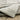 Oriental Weavers Cambria 4928A Beige and Gray Hallway Runner Polypropylene Runner Rug 1'10" x 7'6" — draped to show softness and drape