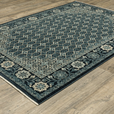 Oriental Weavers Capella CAP03 Deep Blue and Ivory Medium Living Room Rug Medallion Area Rug 5'3" x 7'6" — angled view showing pattern scale