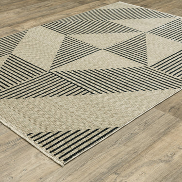 Oriental Weavers Capella CAP04 Beige and Deep Navy Medium Living Room Rug Polyester Area Rug 5'3" x 7'6" — angled view showing pattern scale
