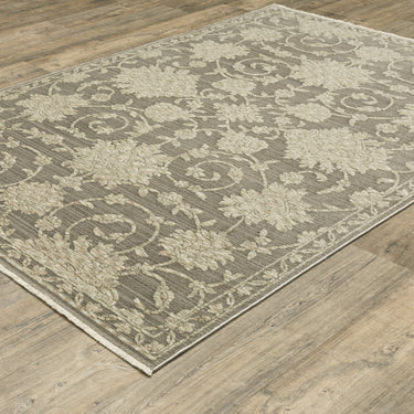Oriental Weavers Capella Grey CAP09 Gray and Beige Medium Living Room Rug Polyester Area Rug 5'3" x 7'6" — angled view showing pattern scale