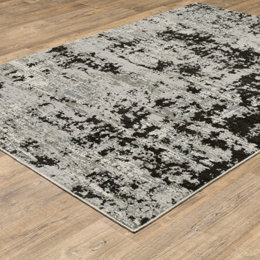 Oriental Weavers Caravan Grey 4153Q Gray and Black Medium Living Room Rug Modern Area Rug 5'3" x 7'6" — angled view showing pattern scale